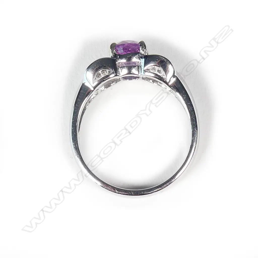 An 18ct white gold pink sapphire and diamond ring Image 1++