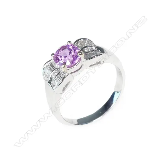 An 18ct white gold pink sapphire and diamond ring