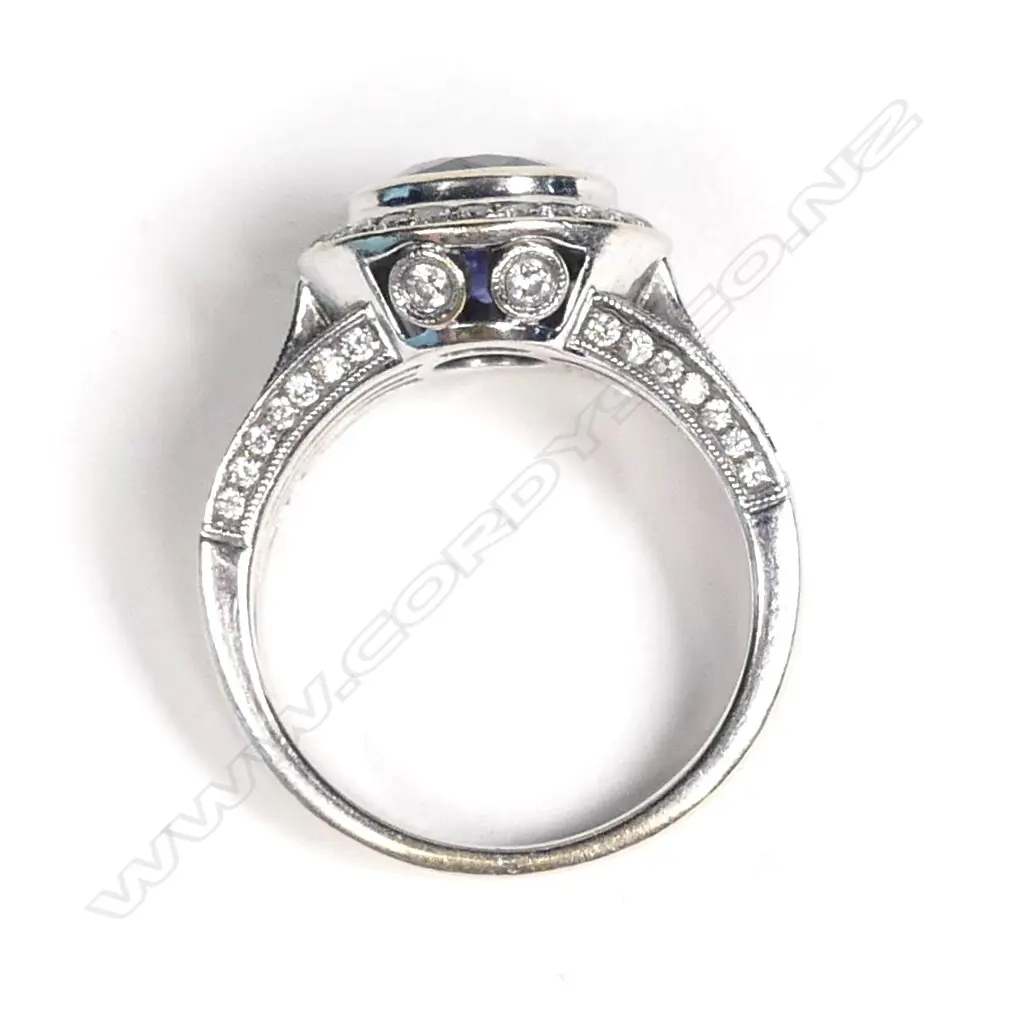 An 18ct. white gold sapphire and diamond ring Image 1++