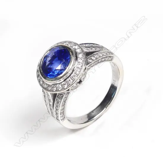 An 18ct. white gold sapphire and diamond ring