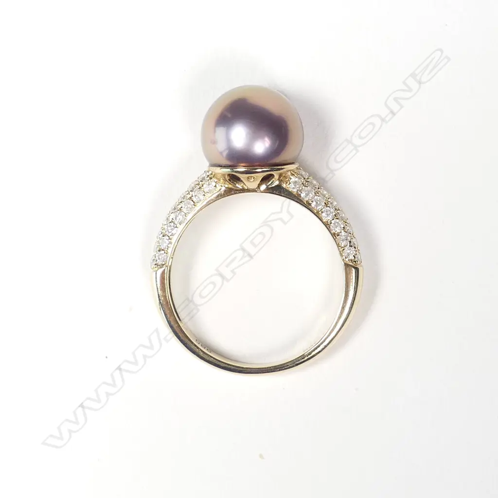 A 14ct gold pearl and diamond dress ring Image 1++