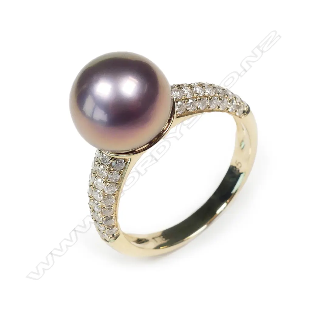 A 14ct gold pearl and diamond dress ring Image 1++