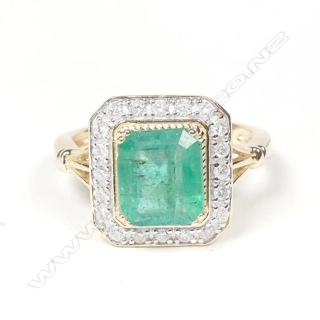 A 14ct gold emerald and diamond ring Image 1++