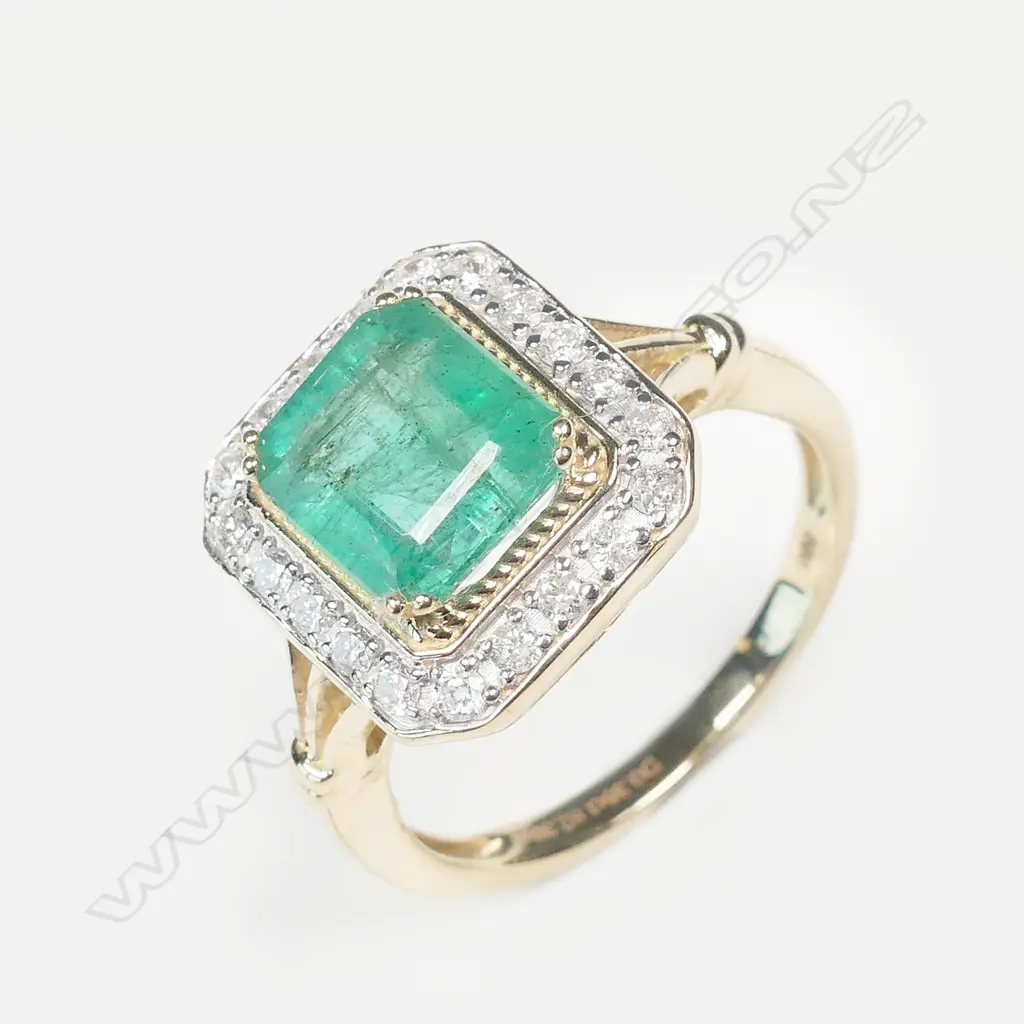 A 14ct gold emerald and diamond ring Image 1++
