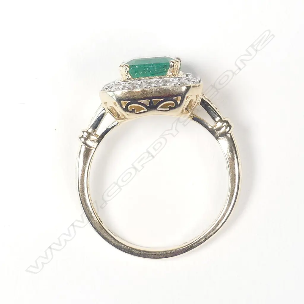 A 14ct gold emerald and diamond ring Image 1++