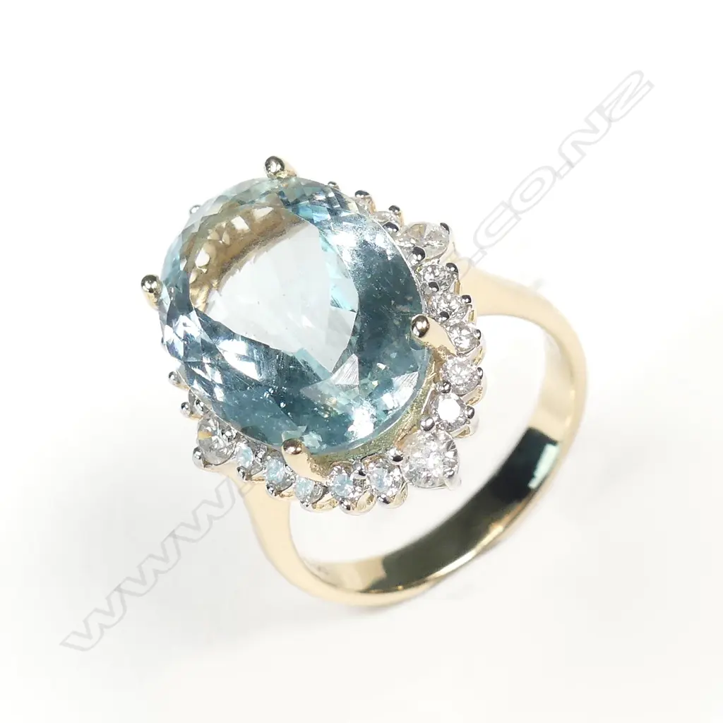A 14ct gold aquamarine and diamond ring Image 1++