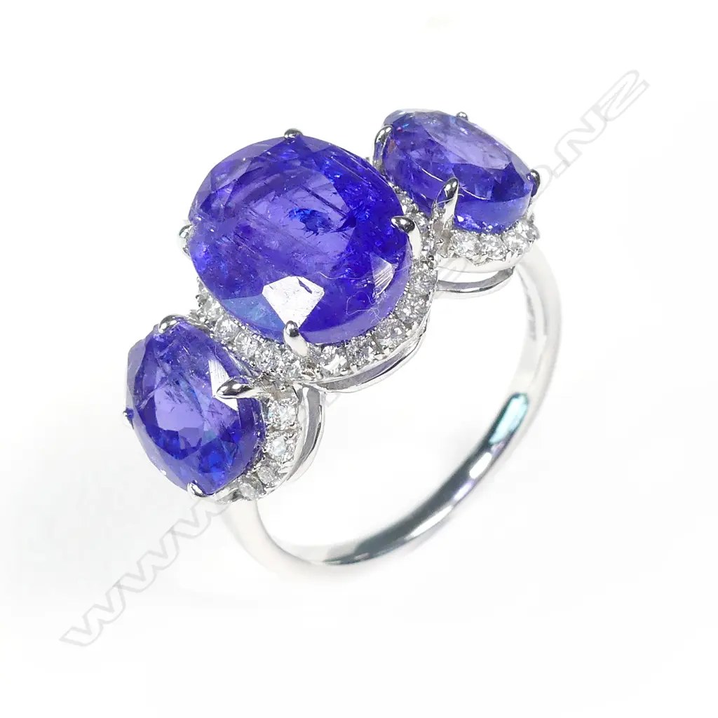 A 14ct white gold tanzanite and diamond trilogy ring Image 1++