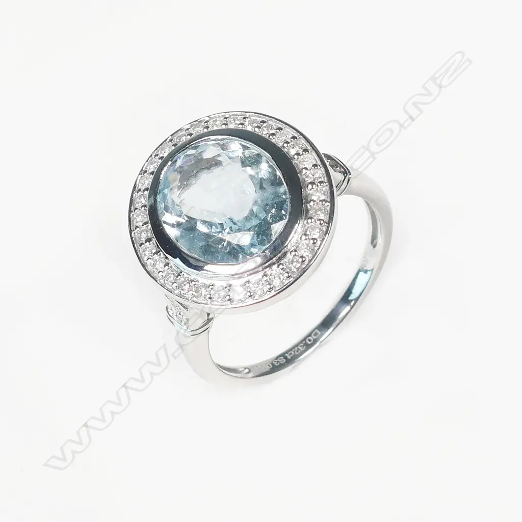 A 14ct white gold aquamarine and diamond ring Image 1++