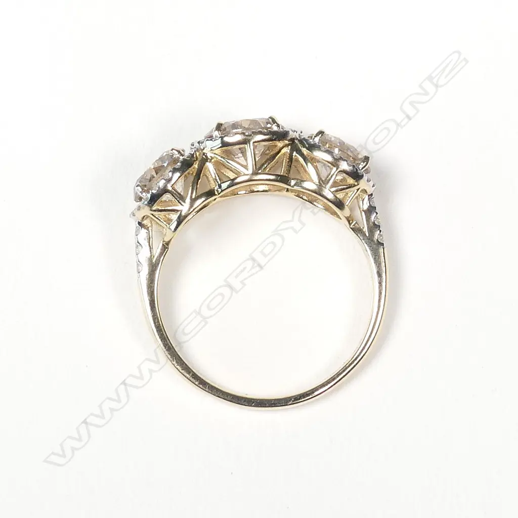 A 14ct gold and diamond trilogy ring Image 1++
