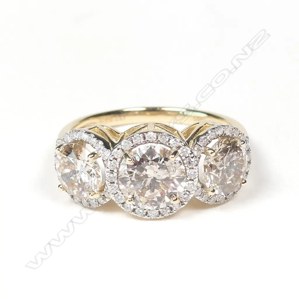 A 14ct gold and diamond trilogy ring Image 1++