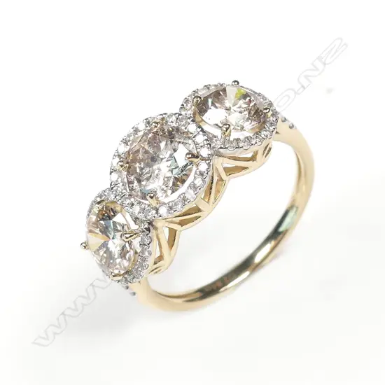 A 14ct gold and diamond trilogy ring