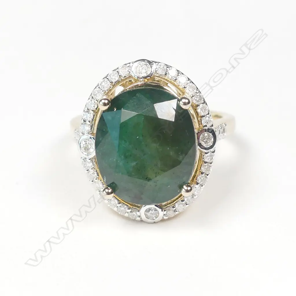 A 14ct gold emerald and diamond ring Image 1++