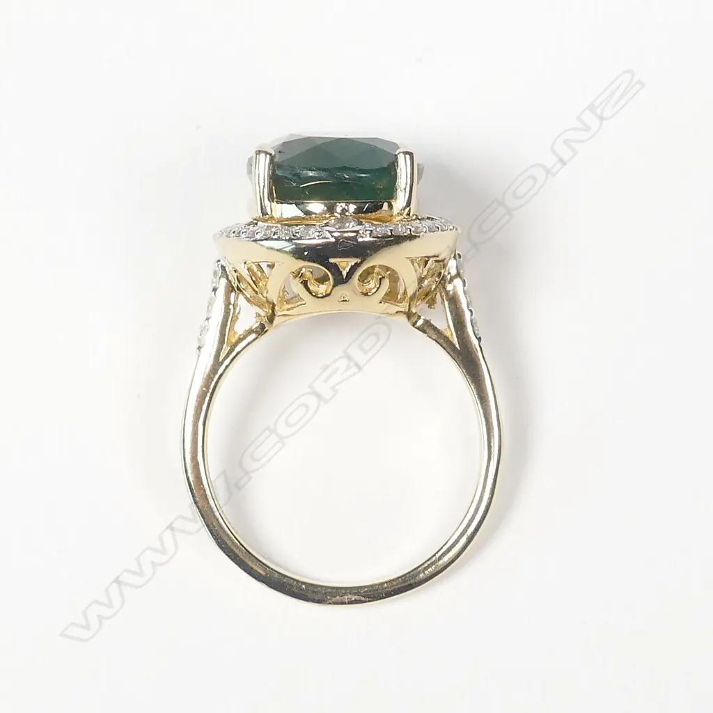 A 14ct gold emerald and diamond ring Image 1++