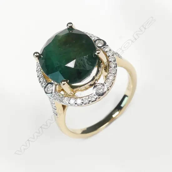 A 14ct gold emerald and diamond ring