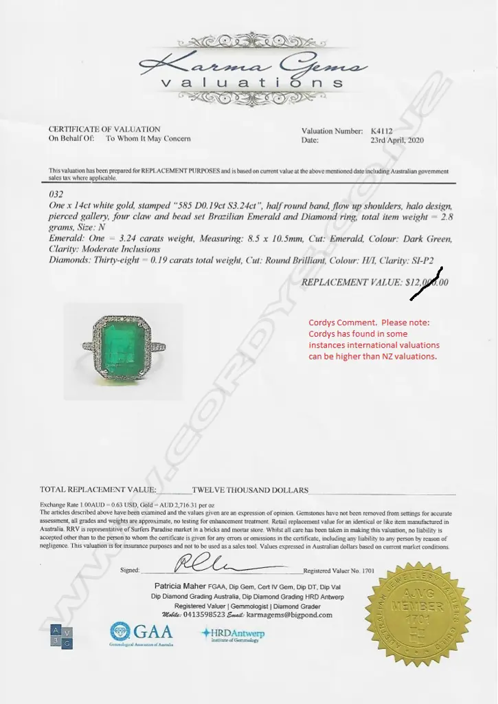 A 14ct white gold emerald and diamond ring Image 1++