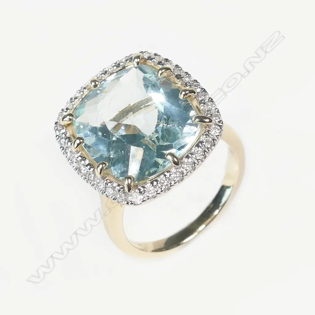 A 14ct gold aquamarine and diamond ring Image 1++