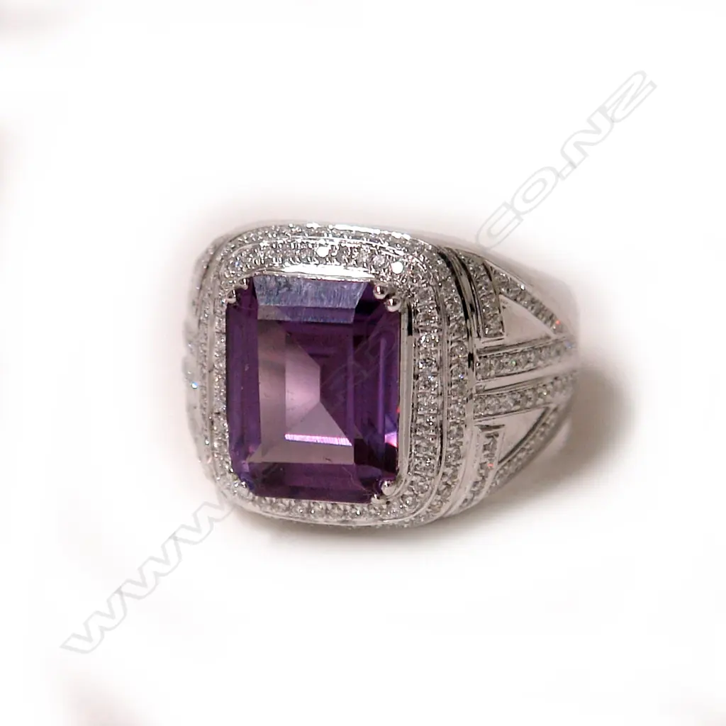 An 18ct. white gold amethyst and diamond large modern dress ring Image 1++
