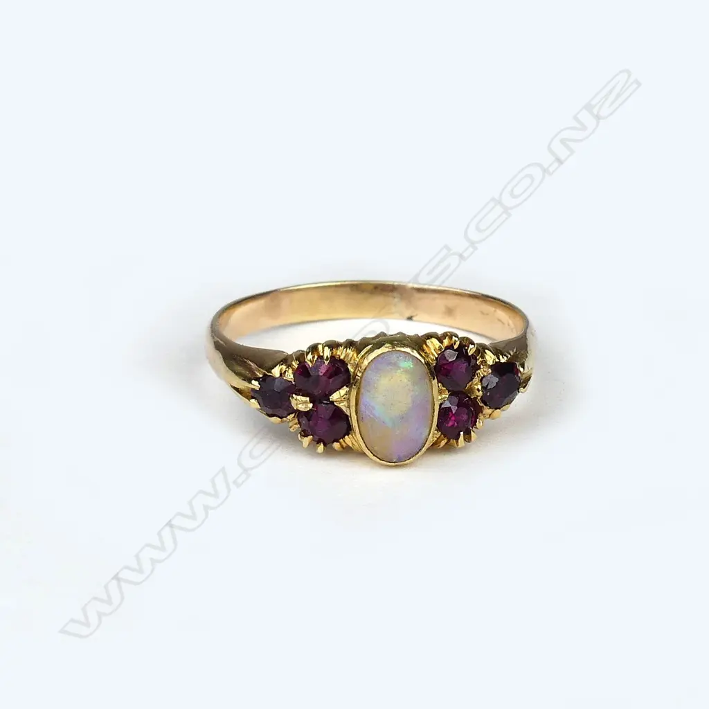 A vintage 9ct. yellow gold opal and ruby ring Image 1++
