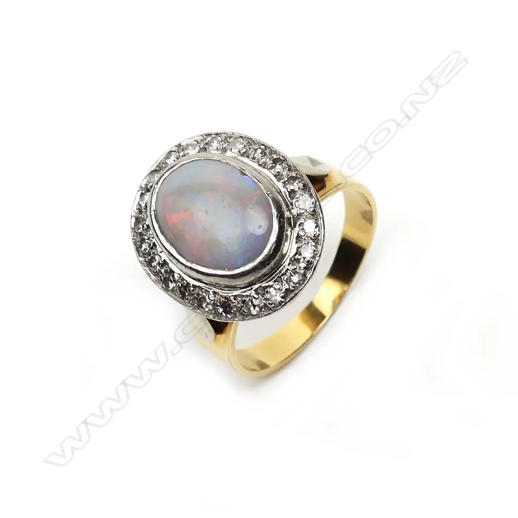 An 18ct yellow and white gold opal and diamond ring Image 1++