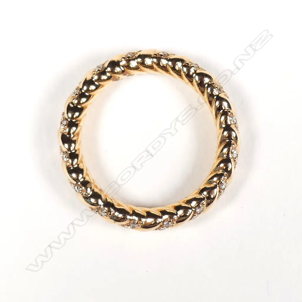 An 18ct rose gold and diamond eternity band Image 1++