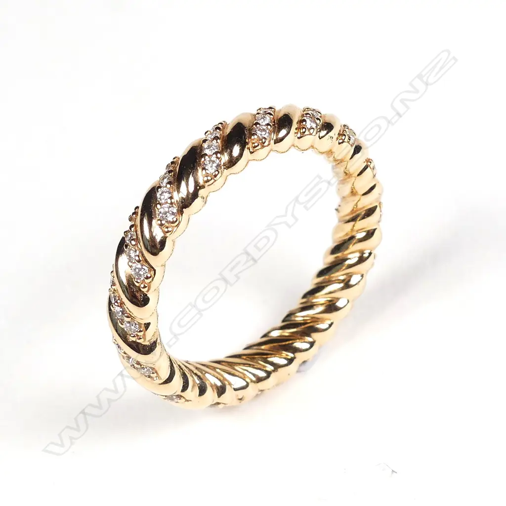 An 18ct rose gold and diamond eternity band Image 1++