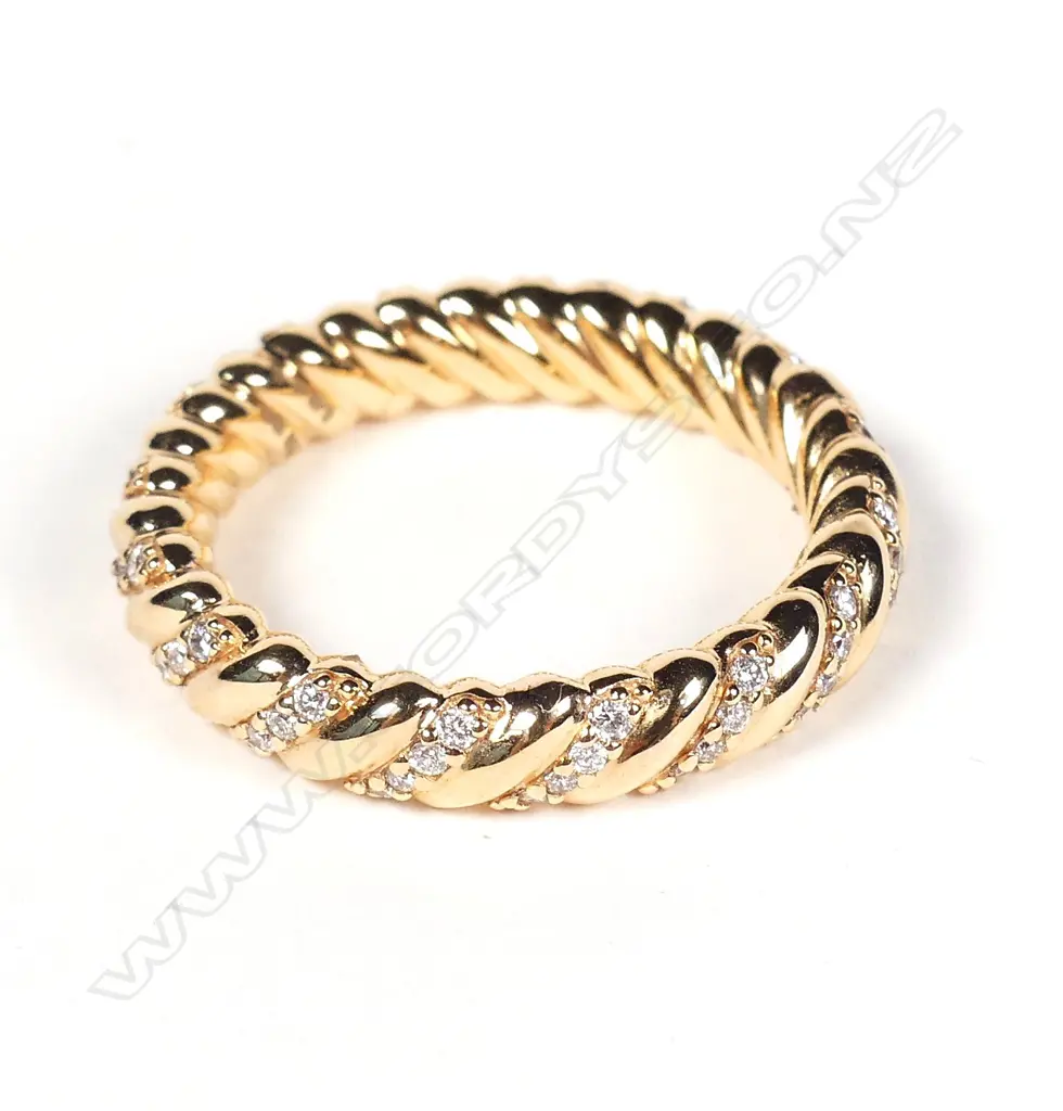 An 18ct rose gold and diamond eternity band Image 1++