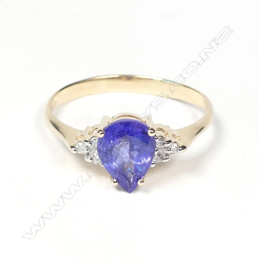 A 14ct gold tanzanite and diamond ring Image 1++