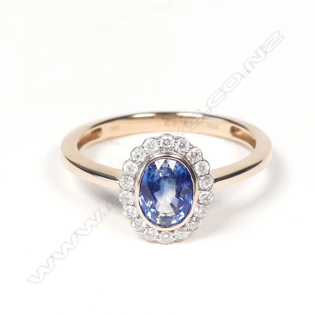 A 14ct rose gold sapphire and diamond ring Image 1++