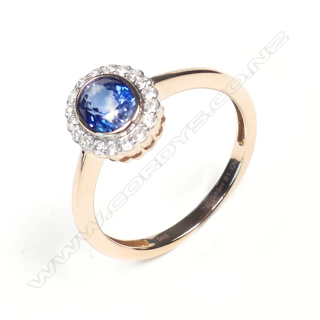A 14ct rose gold sapphire and diamond ring Image 1++