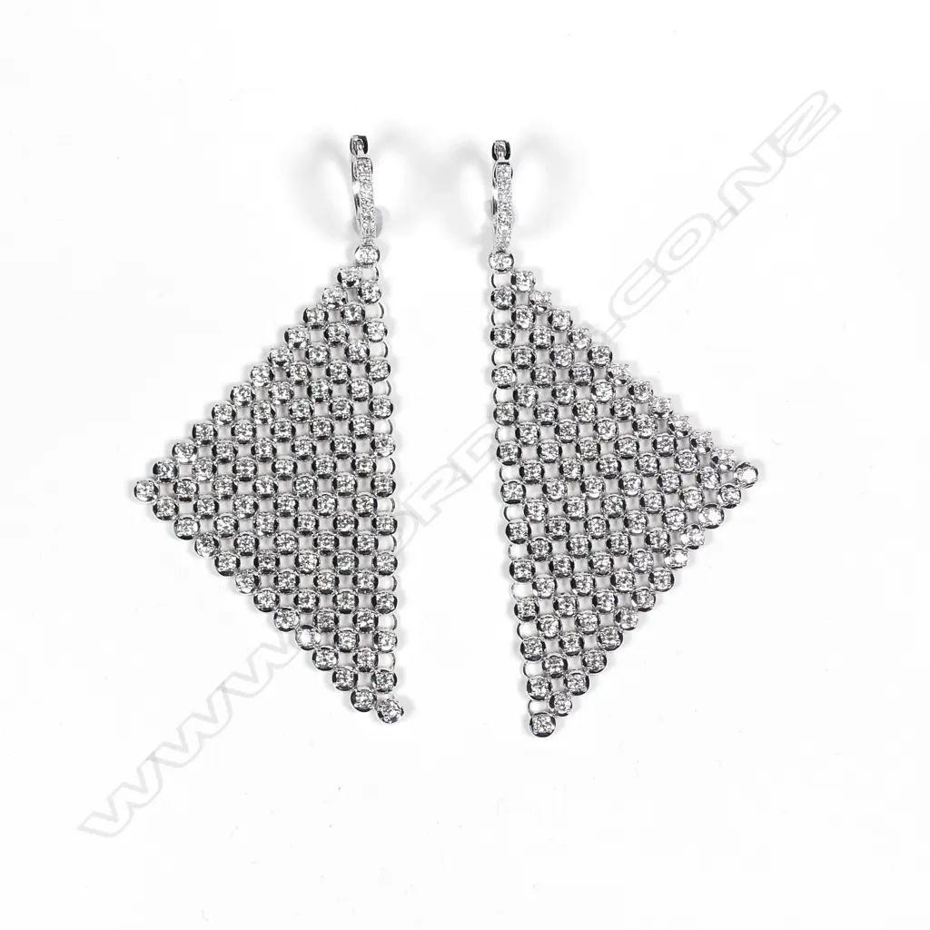 A pair of modern 18ct. white gold and multi-diamond set 'sail' earrings Image 1++