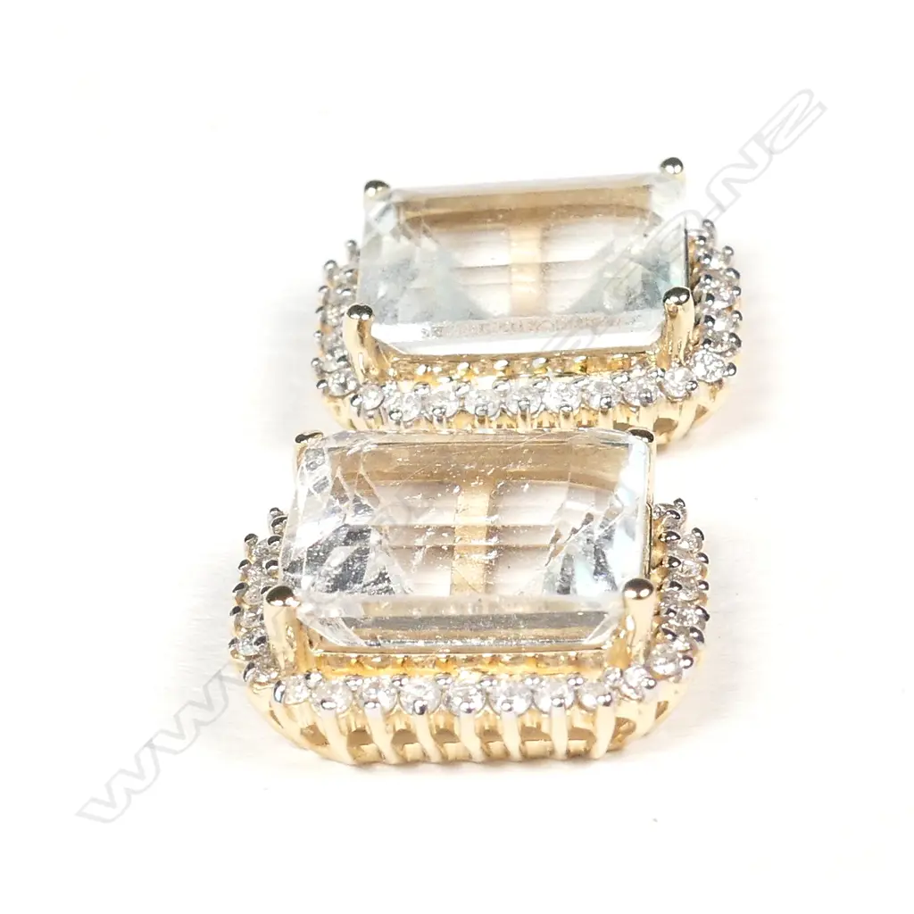 A pair of 14ct gold aquamarine and diamond stud earrings Image 1++