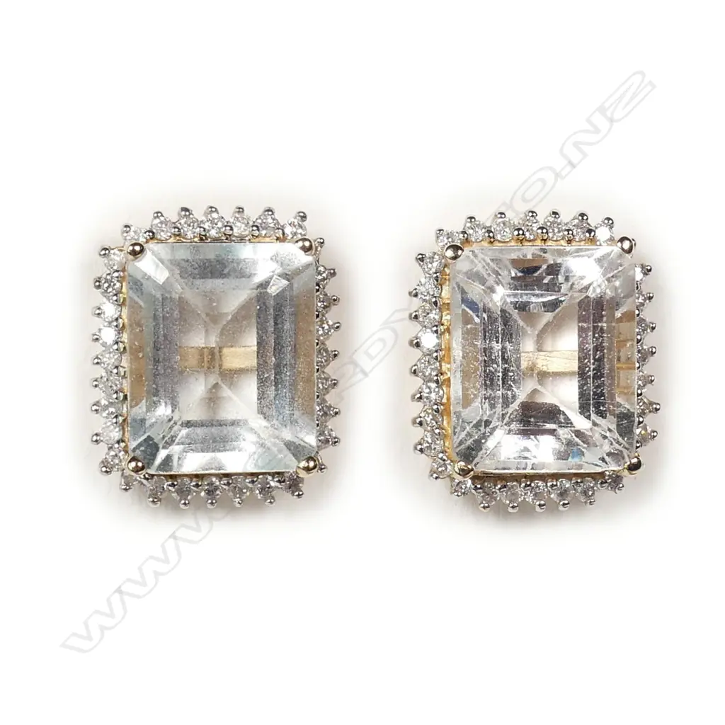 A pair of 14ct gold aquamarine and diamond stud earrings Image 1++
