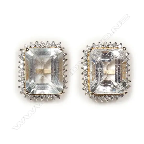 A pair of 14ct gold aquamarine and diamond stud earrings