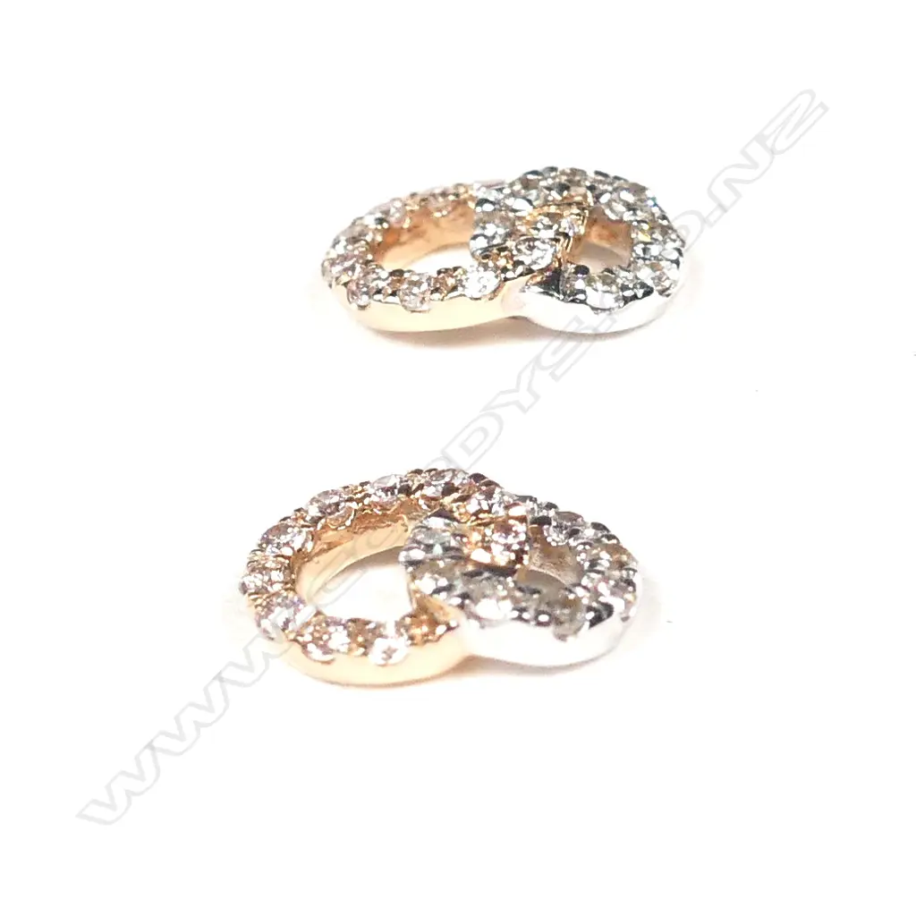 A pair of 18ct two tone gold diamond earrings Image 1++