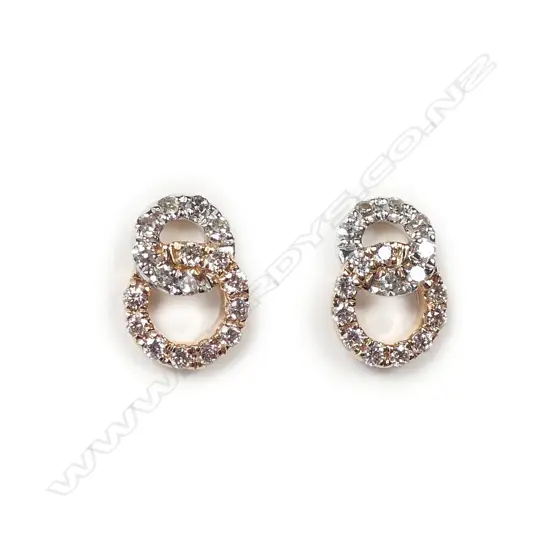 A pair of 18ct two tone gold diamond earrings