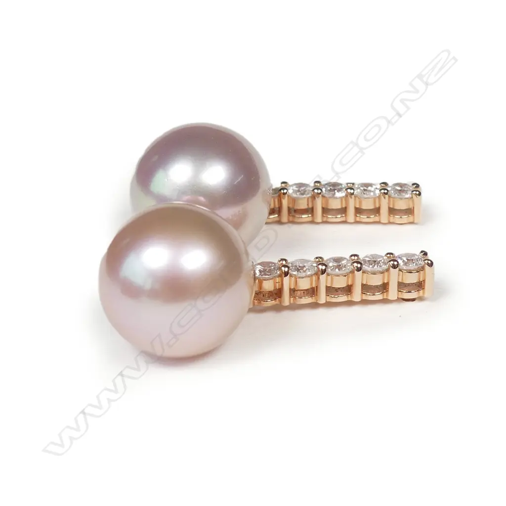 A pair of 14ct rose gold pearl and diamond earrings Image 1++