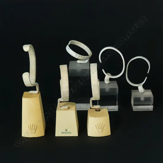 Six Rolex and Jaeger-LeCoultre wristwatch display shop stands