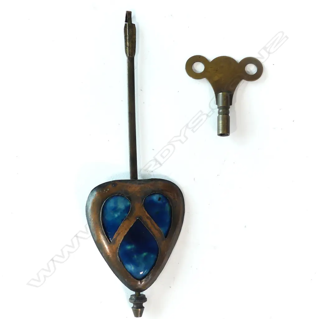 An Arts and Crafts oak and copper Liberty style mantel clock Image 1++