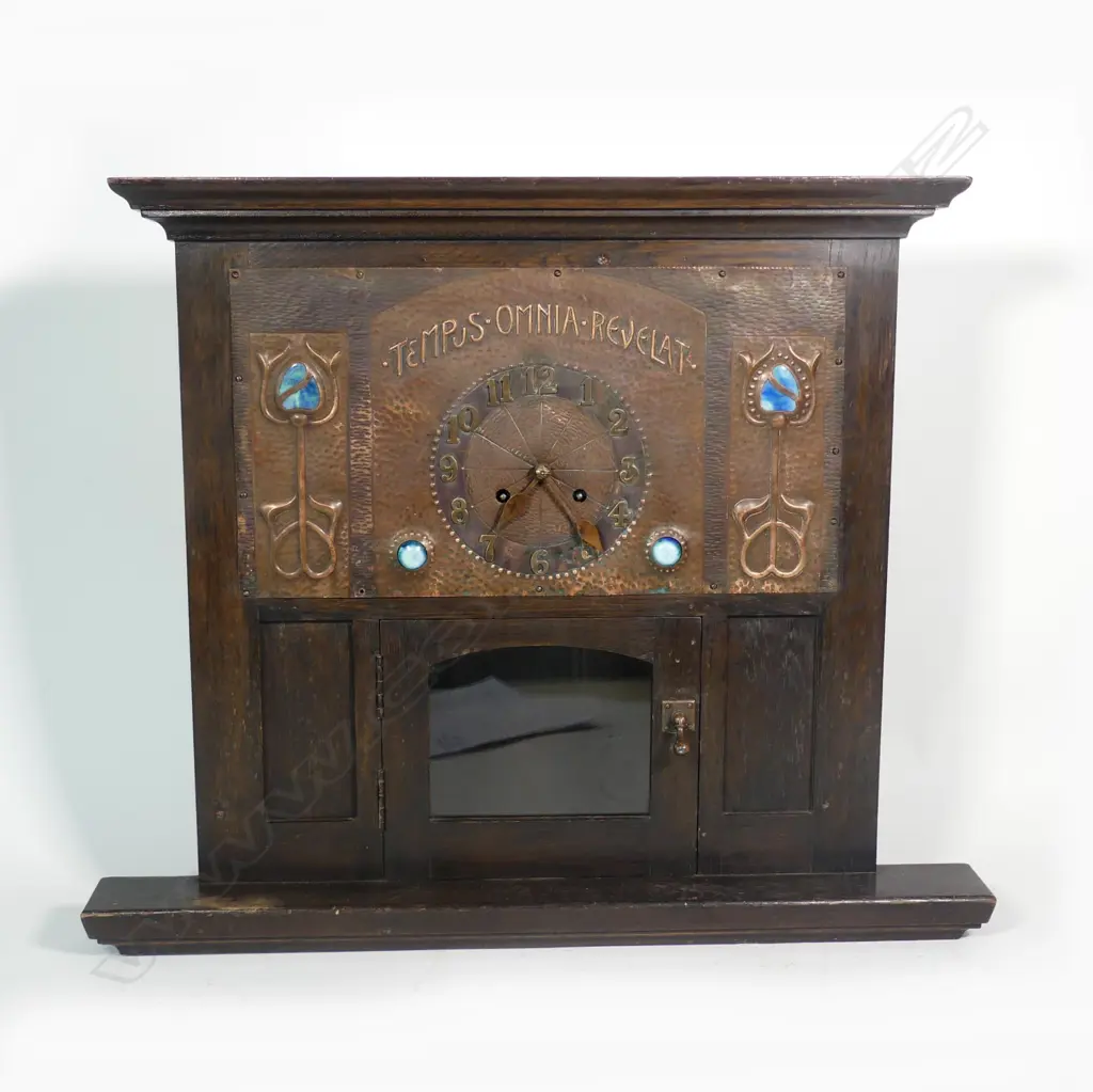 An Arts and Crafts oak and copper Liberty style mantel clock Image 1++