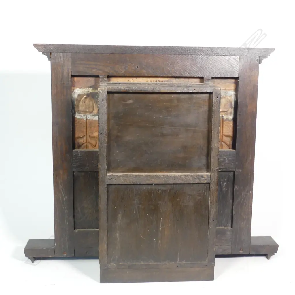 An Arts and Crafts oak and copper Liberty style mantel clock Image 1++