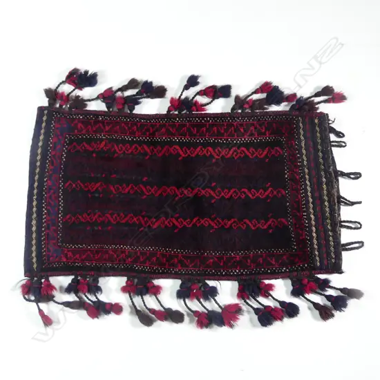 An Afghan bedding bag