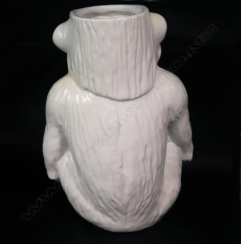 A modern white glazed ceramic walking stick stand modelled as a seated chimpanzee Image 1++