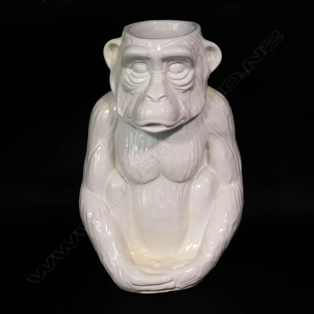 A modern white glazed ceramic walking stick stand modelled as a seated chimpanzee Image 1++