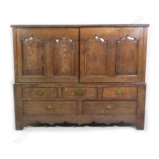 A Georgian oak livery cupboard
