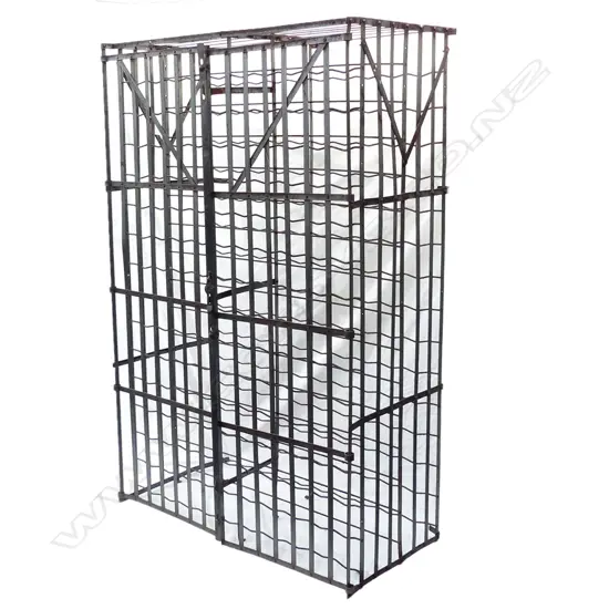 A vintage French wrought iron wine cage