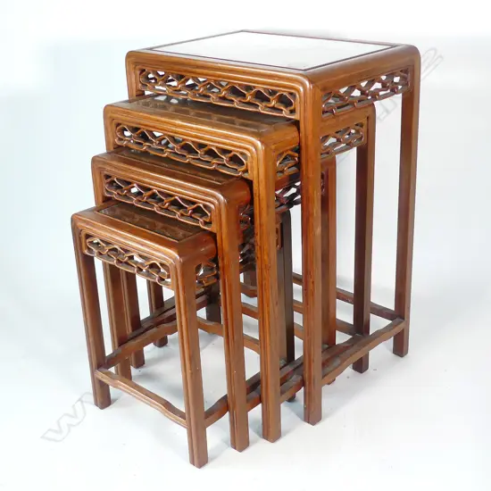 A nest of four Chinese teak occasional tables