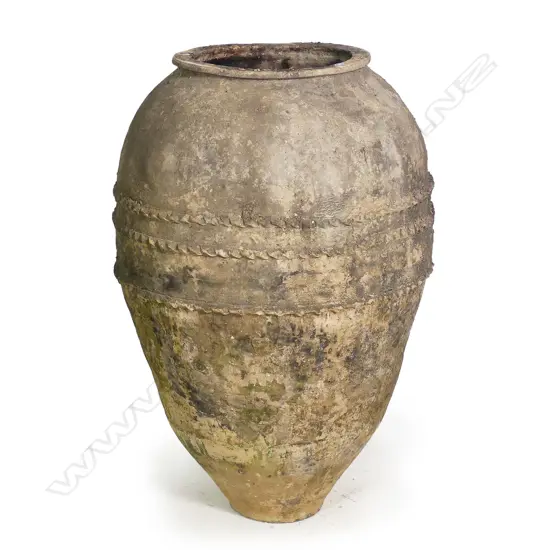 An old European terracotta tall olive oil storage jar