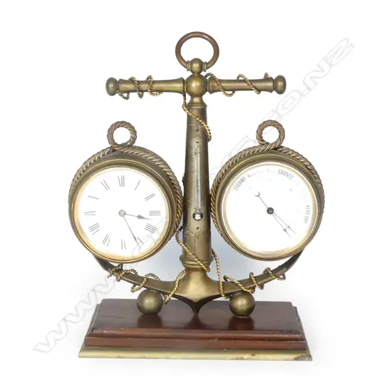 A nautical themed clock and barometer combination in brass