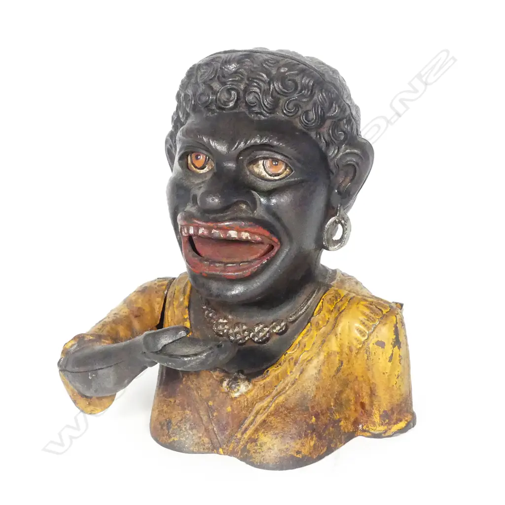 A Dinah cast iron money box Image 1++