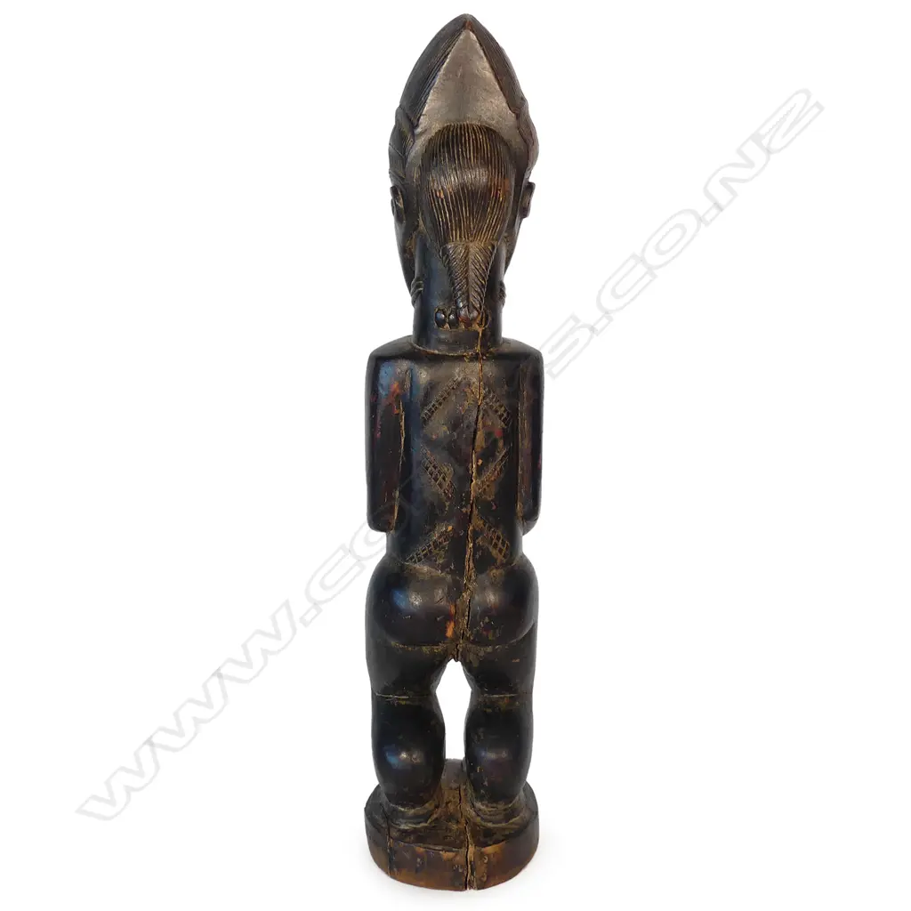 A West African carved wood female figure Image 1++